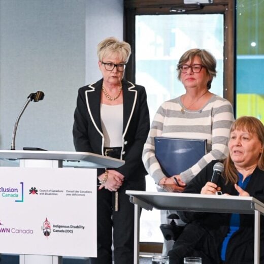 (L-R) Krista Carr, Executive Vice-President of Inclusion Canada, Bonnie Brayton, CEO of DAWN Canada, and Heather Walkus, Chair of CCD delivering their remarks at today’s press conference challenging discriminatory sections of Canada’s assisted dying law in court. (CNW Group/Inclusion Canada)